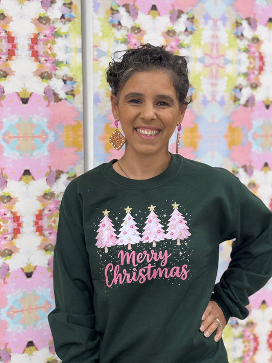 Pink Christmas trees in forest green