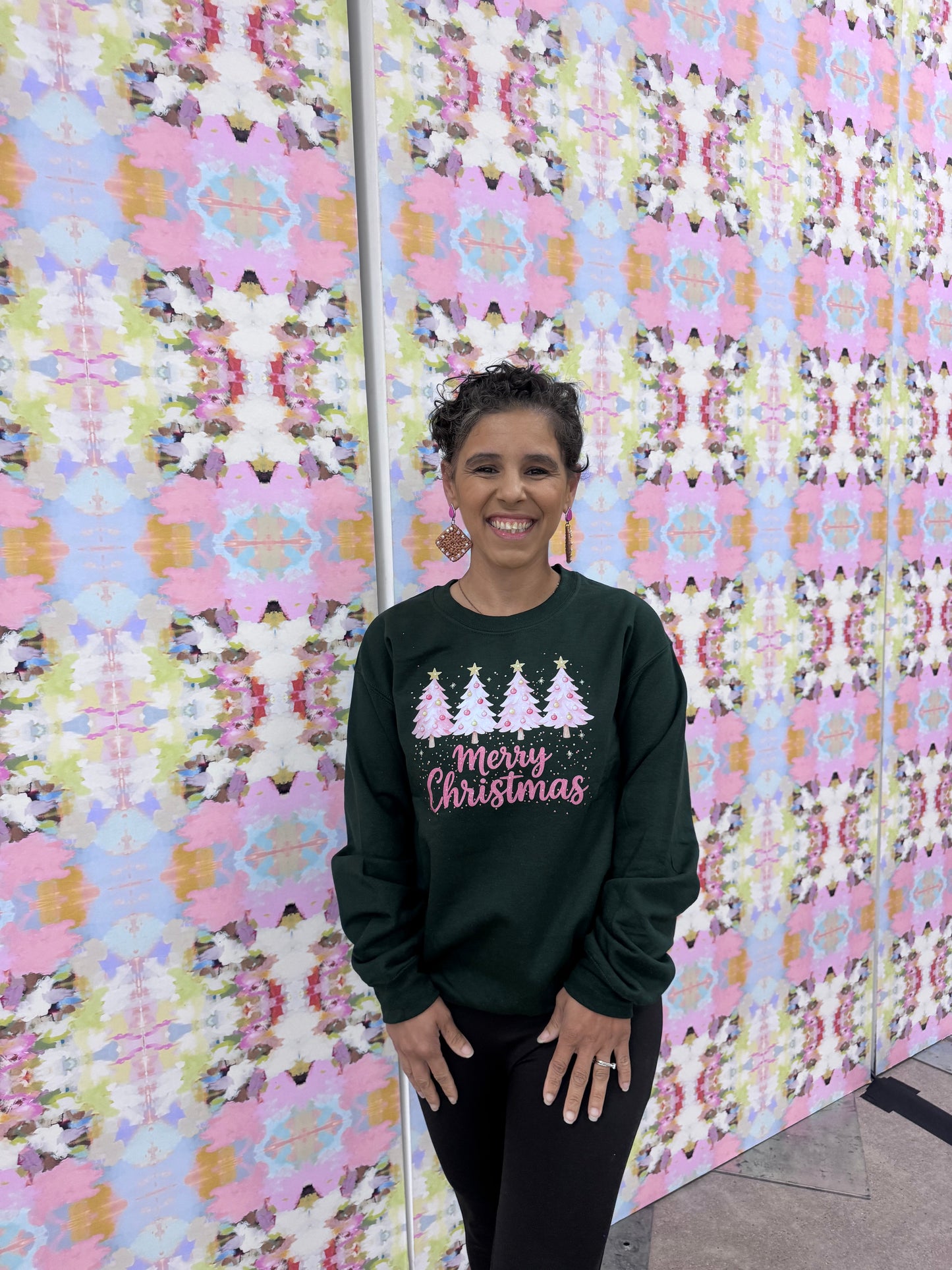 Pink Christmas trees in forest green